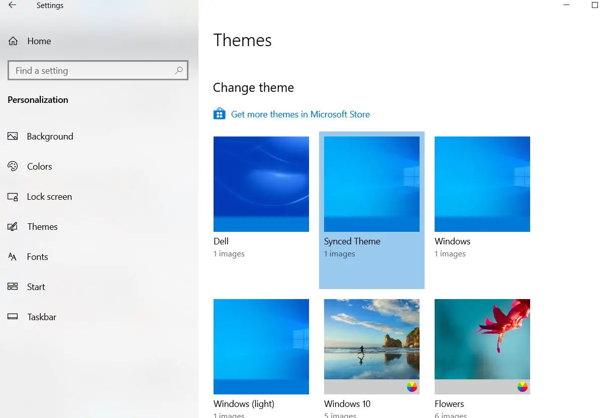 where are downloaded theme pictures stored in windows 10